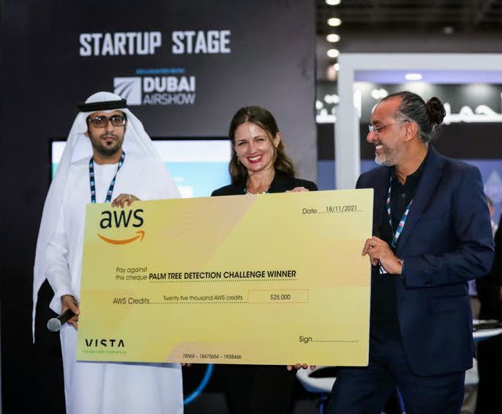 ForestSATai receiving the AWS Space Challenge winner's cheque on the Startup Stage at the Dubai Airshow, November 2021